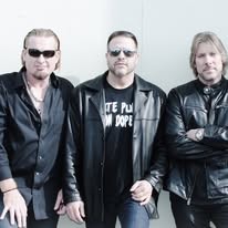 Three POWER members in sunglasses and black jackets